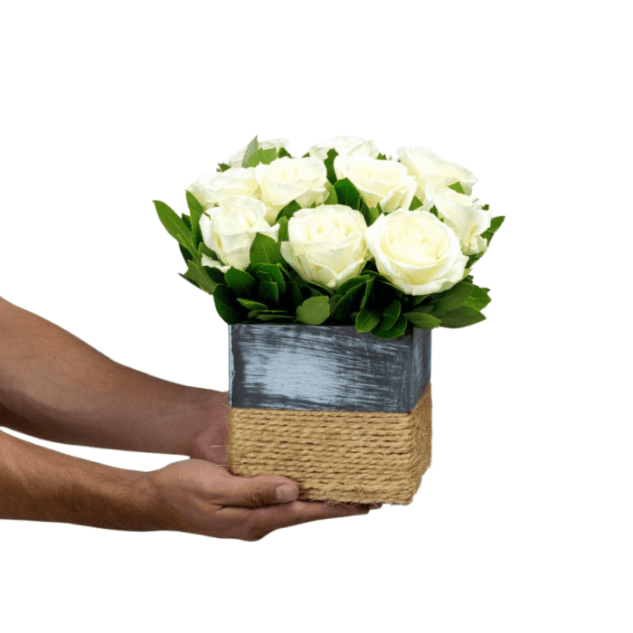 Flower Arrangement with White Roses in Wooden Chapeau