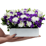 Flower Arrangement with Purple Lysianthus and Rose Blossoms in Wooden Box