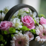 Flower Arrangement with Pink Gerberas and Roses in a Wooden Basket