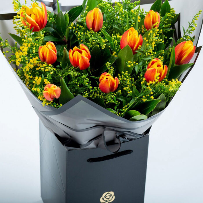 Bouquet with 10 Orange Tulips in Coconut wrapping