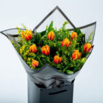 Bouquet with 10 Orange Tulips in Coconut wrapping