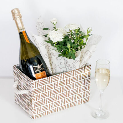 White Rose in a Basket with White Sparkling Wine