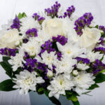 Flower Arrangement with White Roses and Amaranths in Clay Maspeaux