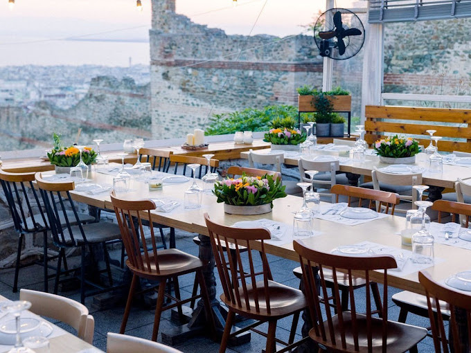 Beautiful flower arrangements on the wedding reception tables in the Castles of Thessaloniki